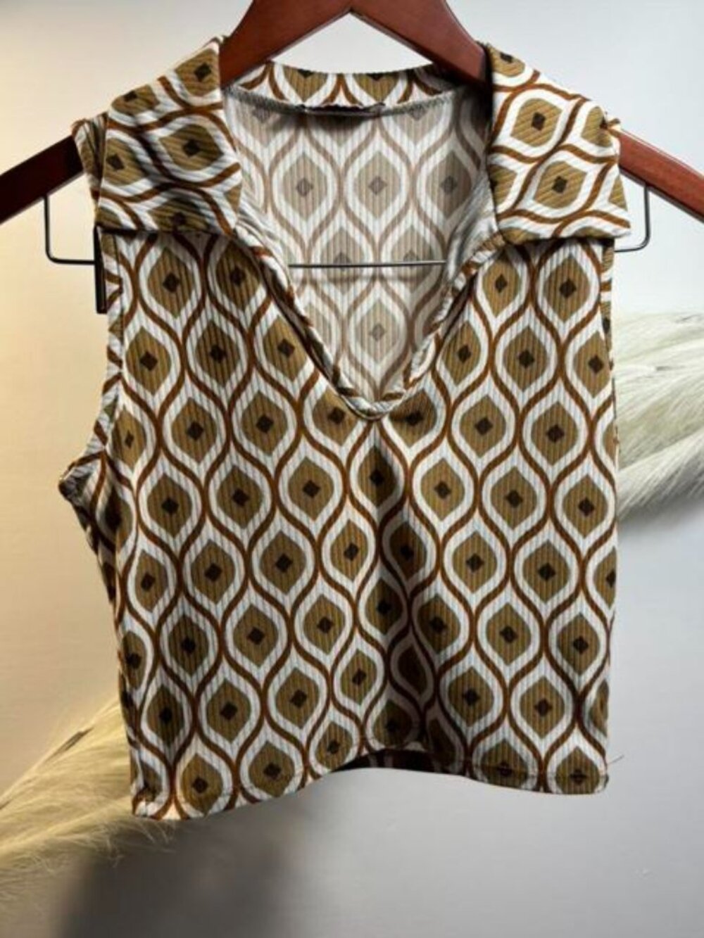 (#26) Brown and white patterned sleeveless blouse with a V-neckline